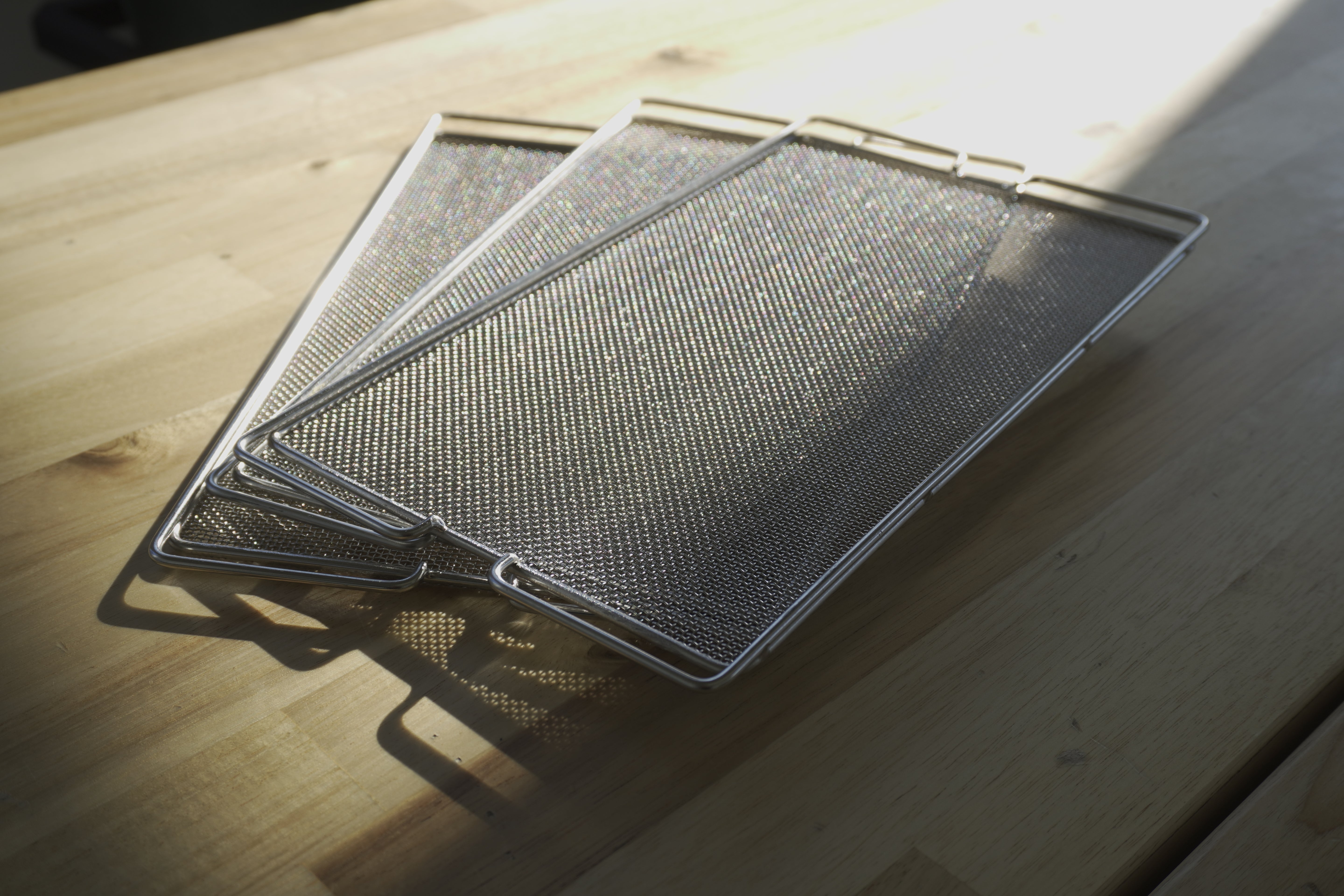 Stainless steel meshes used for growing greens in the Minigro microfarm.