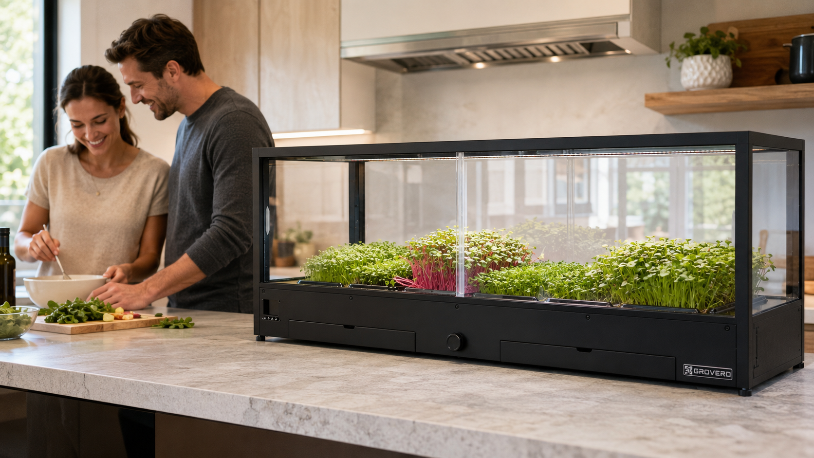 Couple preparing food in a kitchen with a hydroponic microfarm on the counter.